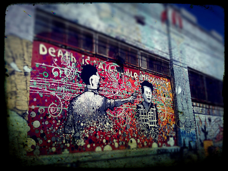 Death is a Laughable Impossibility mural by Locust 